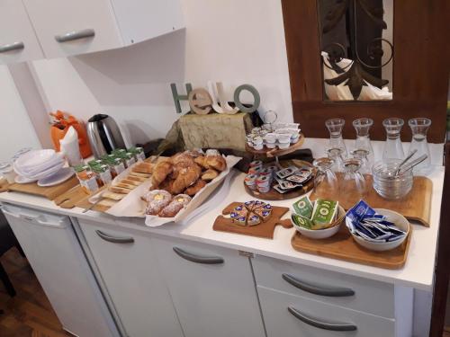 a kitchen with a counter with food on it at Trastevere Rooms in Rome