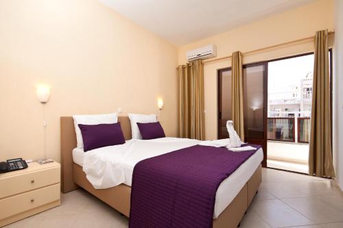 Postel nebo postele na pokoji v ubytování Aparthotel Praiano