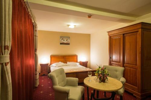 Ένα ή περισσότερα κρεβάτια σε δωμάτιο στο Red Hotel