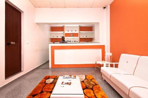 a living room with a couch and a table at Aparthotel Praiano in Praia