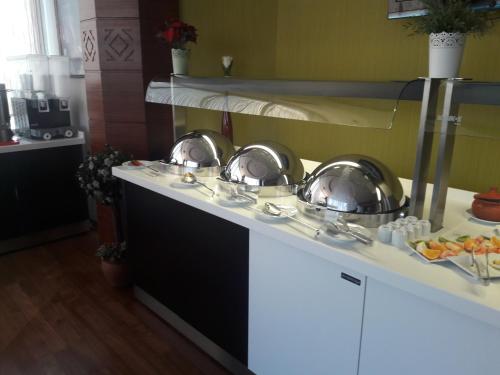a kitchen with two pans on a counter at dovsOtel in Manisa
