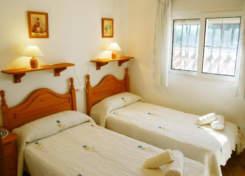 Postel nebo postele na pokoji v ubytování Villa Dolores