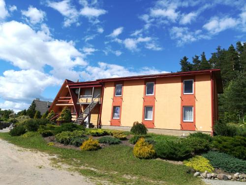 a house on the side of a road at Oāze Smiltenē in Smiltene