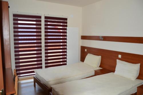 Ένα ή περισσότερα κρεβάτια σε δωμάτιο στο Arabella Hotel