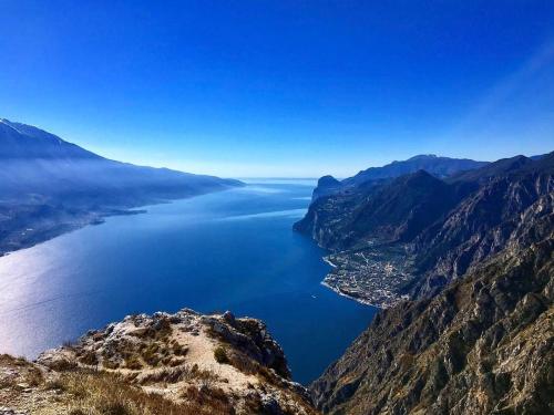 a view of a body of water from a mountain at Appartamenti Villa Clivia in Limone sul Garda