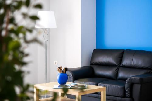 a living room with a couch and a table at Hera Zakynthos Hotel in Laganas