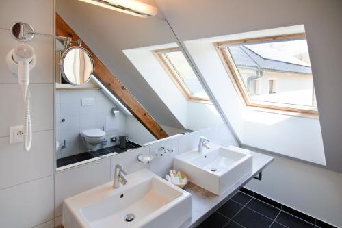a bathroom with a sink and a mirror at Davidův mlýn in Staré Těchanovice