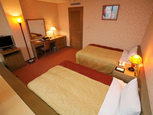 Katil atau katil-katil dalam bilik di Izumigo Kiyosato Kogen Hotel