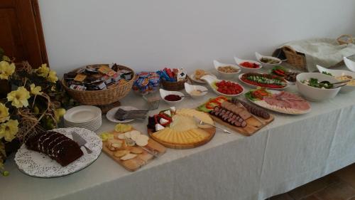 a table with many different types of food on it at Willa Kominiarski Wierch in Zakopane