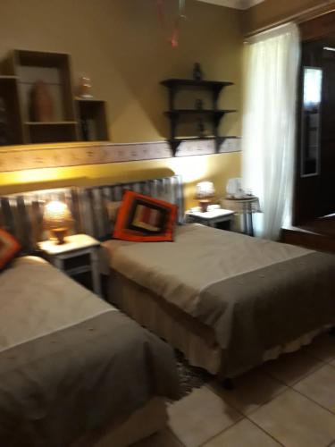Postel nebo postele na pokoji v ubytování Protea B&B