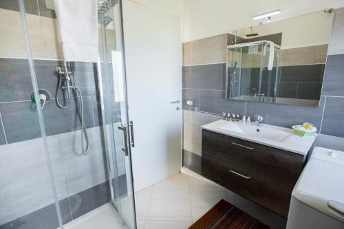 a bathroom with a sink and a shower at Le Zagare in Lascari