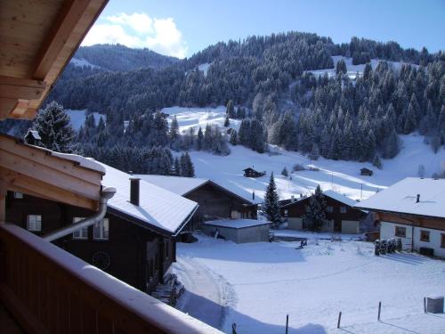 a view of a snow covered mountain from a balcony at Gästehaus Alpenblick Wildstrubel in Sankt Stephan