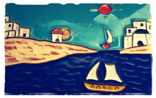 a painting of a beach with a sailboat in the water at Barcola Holidays Casa Vacanze in Trieste