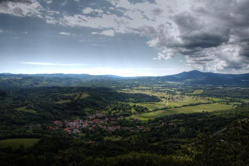 an aerial view of a town in the hills at Tourist farm Pri Andrejevih in Narin