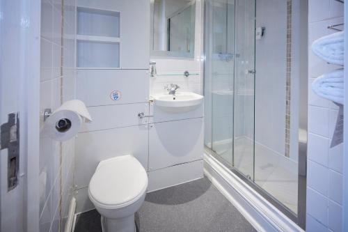 a bathroom with a toilet and a sink and a shower at Childwall Abbey, Liverpool by Marston's Inns in Liverpool