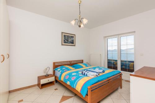 Postel nebo postele na pokoji v ubytování Villa Iž