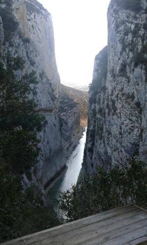 a view of a river through a rocky cliff at Casa Antonia in Vilaller