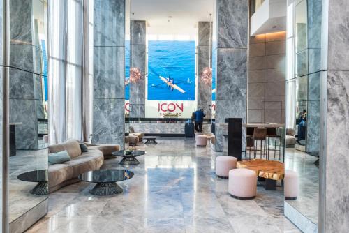 a lobby with a couch and a table at Icon Hotel in Santiago