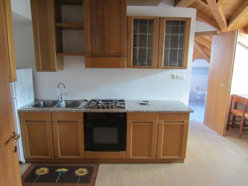 a kitchen with a sink and a stove in it at Alla Torretta in Bellagio
