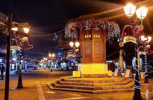 a street at night with christmas lights at Prenociste DM5 in Novi Pazar