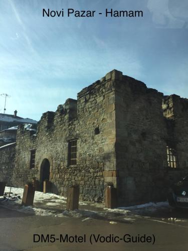 an old stone building with the words now parson hamann at Prenociste DM5 in Novi Pazar