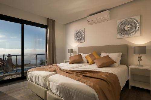 Postel nebo postele na pokoji v ubytování Villa Guiné