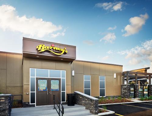 a building with a burger king sign on it at Best Western Plus Edmonton Airport Hotel in Leduc