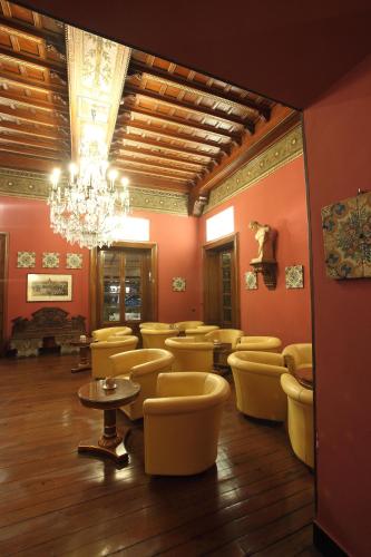 a large room with chairs and a chandelier at Grand Hotel Villa Balbi in Sestri Levante