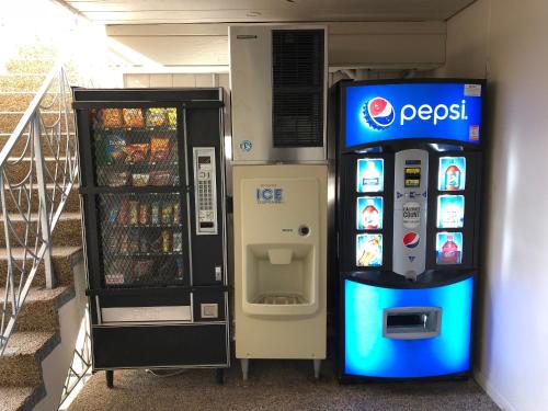 a pepsi machine next to a soda machine at City Center Inn and Suites in San Francisco