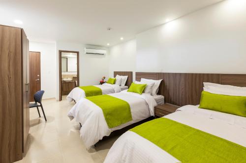 מיטה או מיטות בחדר ב-Torca Hotel