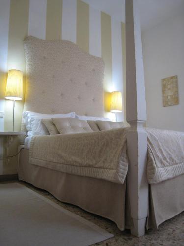 Postel nebo postele na pokoji v ubytování Fontelunga Hotel & Villas