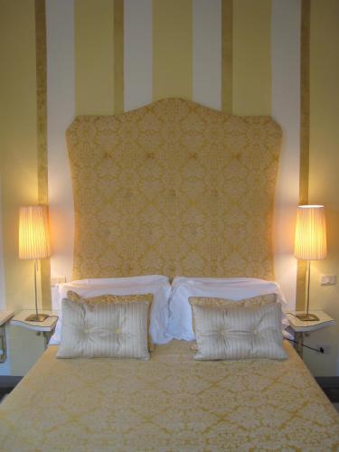 Postel nebo postele na pokoji v ubytování Fontelunga Hotel & Villas