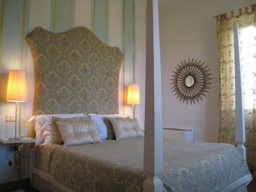 Postel nebo postele na pokoji v ubytování Fontelunga Hotel & Villas