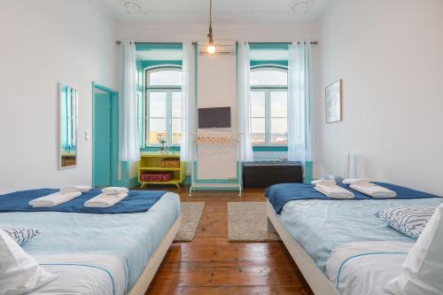 Ένα ή περισσότερα κρεβάτια σε δωμάτιο στο C&O Guest House Lisbon