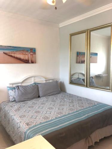 a bedroom with a bed and a window at The Oasis Retreat in Nassau