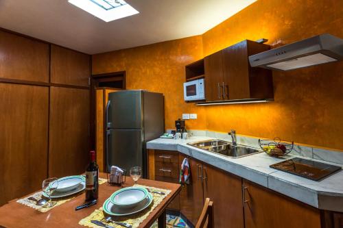 Η κουζίνα ή μικρή κουζίνα στο Merida Serviced Apartments