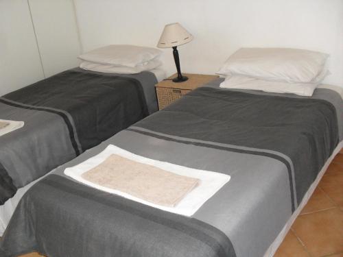 two beds sitting next to each other in a room at Anna Boeremeisie Guesthouse in Benoni