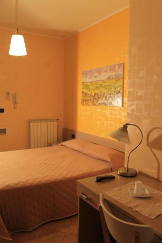 Ένα ή περισσότερα κρεβάτια σε δωμάτιο στο B&B al CASTELLO Torremaggiore