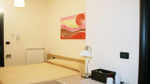 Ένα ή περισσότερα κρεβάτια σε δωμάτιο στο B&B al CASTELLO Torremaggiore