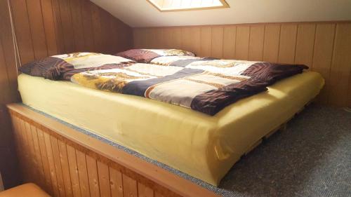 two beds sitting in a corner of a room at Ferienhaus-Cerny in Bad Goisern