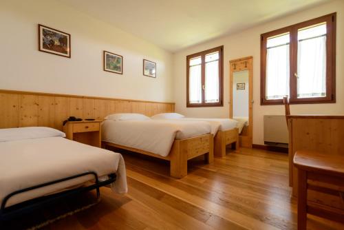 En eller flere senge i et værelse på Agriturismo Nonis