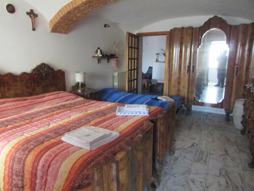 Postel nebo postele na pokoji v ubytování La Terrazza Mombarone