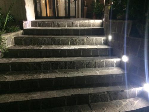 a set of stairs with lights on them at Hotel San Nicola in Lagonegro