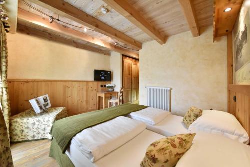 Säng eller sängar i ett rum på Hotel Miravidi a Cervinia