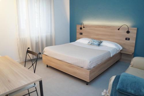 Postel nebo postele na pokoji v ubytování Casa Chiara B&B