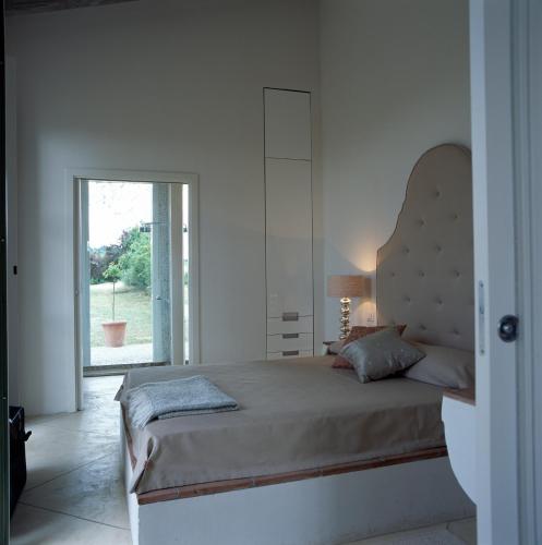 Postel nebo postele na pokoji v ubytování Fontelunga Hotel & Villas