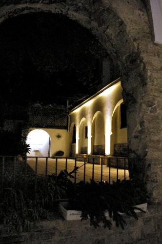 a building lit up at night with lights at San Francesco Resort in Agropoli