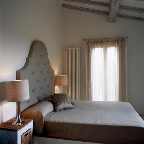 Postel nebo postele na pokoji v ubytování Fontelunga Hotel & Villas