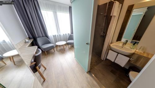 a small bathroom with a sink and a mirror at Hótel Laugarbakki in Laugarbakki