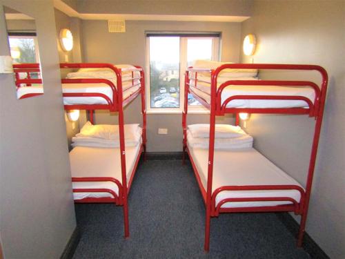 
two bunk beds in a small room at Sleepzone Hostel Galway City in Galway
